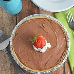 No-Bake Chocolate Cheesecake is a super creamy, quick and easy dessert recipe perfect for BBQs and parties. This dessert whips up in only 10 minutes! www.savoryexperiments.com
