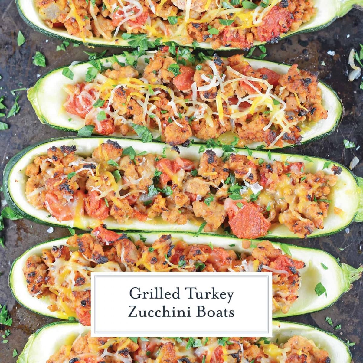 Turkey stuffed zucchini makes the perfect healthy dinner! One of the best zucchini recipes I’ve ever made. #groundturkeyrecipes #grilledzuchhini www.savoryexperiments.com