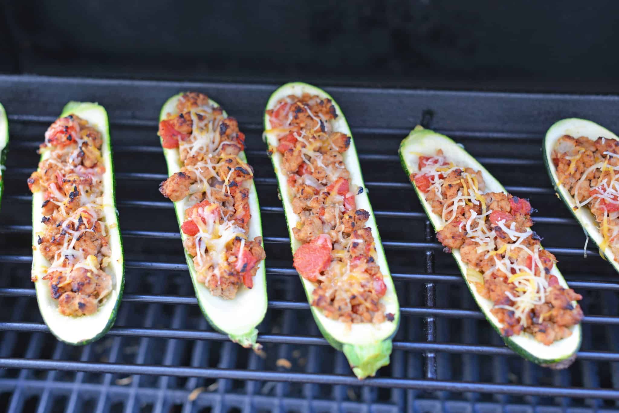 Grilled Turkey Zucchini Boats Recipe - Looking for grilling recipes? Turkey stuffed zucchini makes the perfect healthy dinner! One of the best zucchini recipes I’ve ever made. www.savoryexperiments.com 