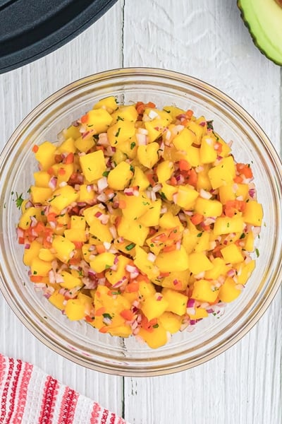 glass bowl of mango salsa