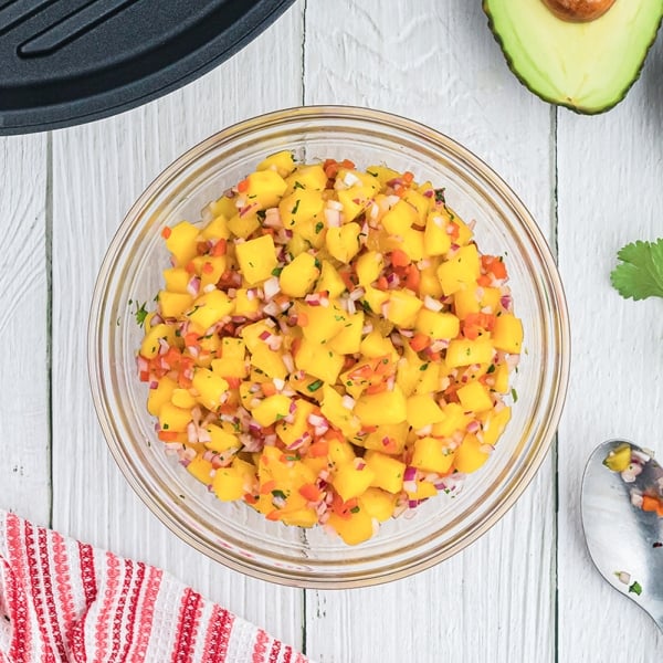 glass bowl of mango salsa