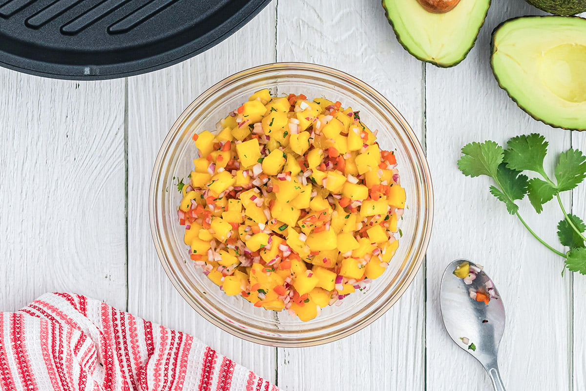 glass bowl of mango salsa