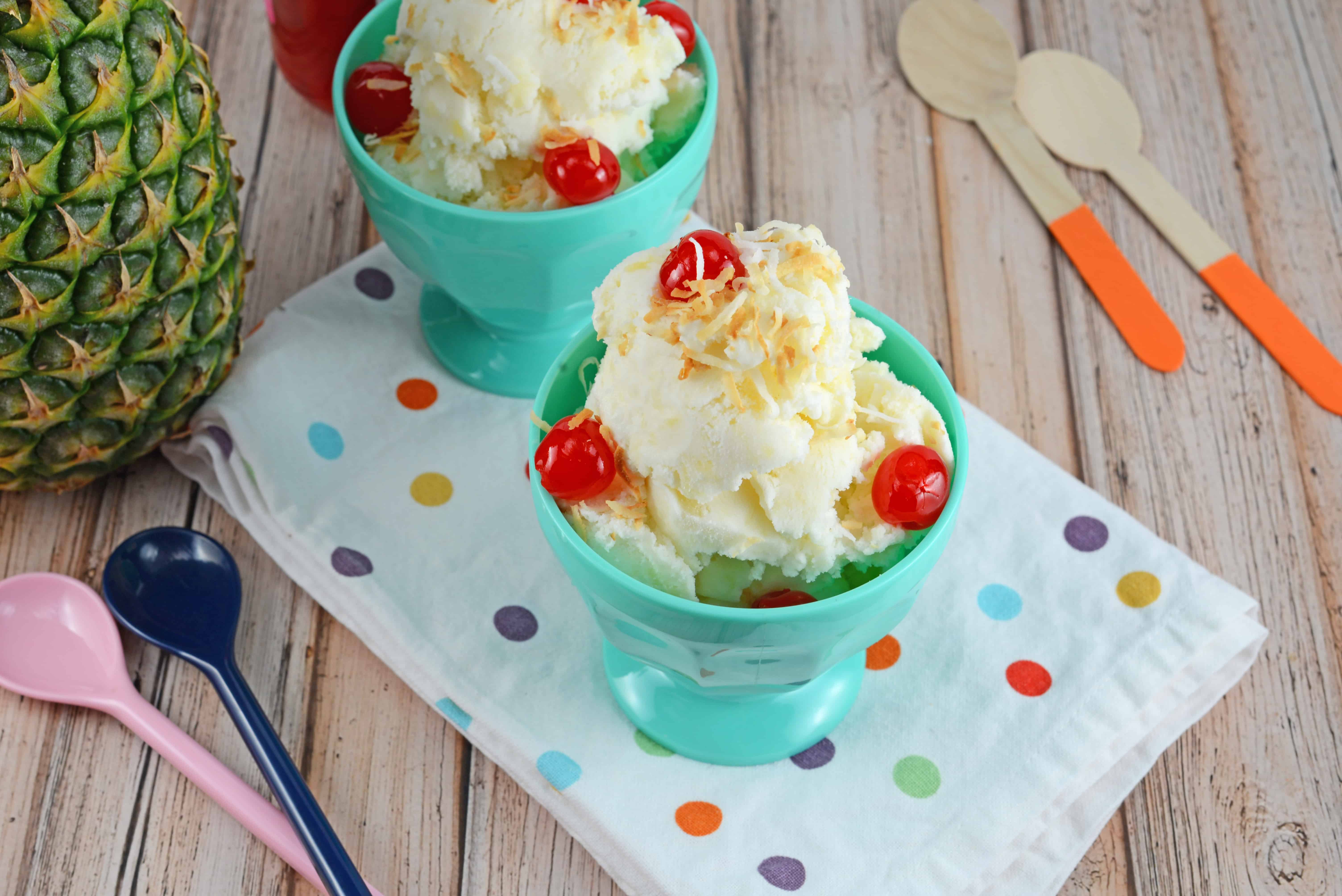 pina colada ice cream in a teal ice cream bowl with cherries 