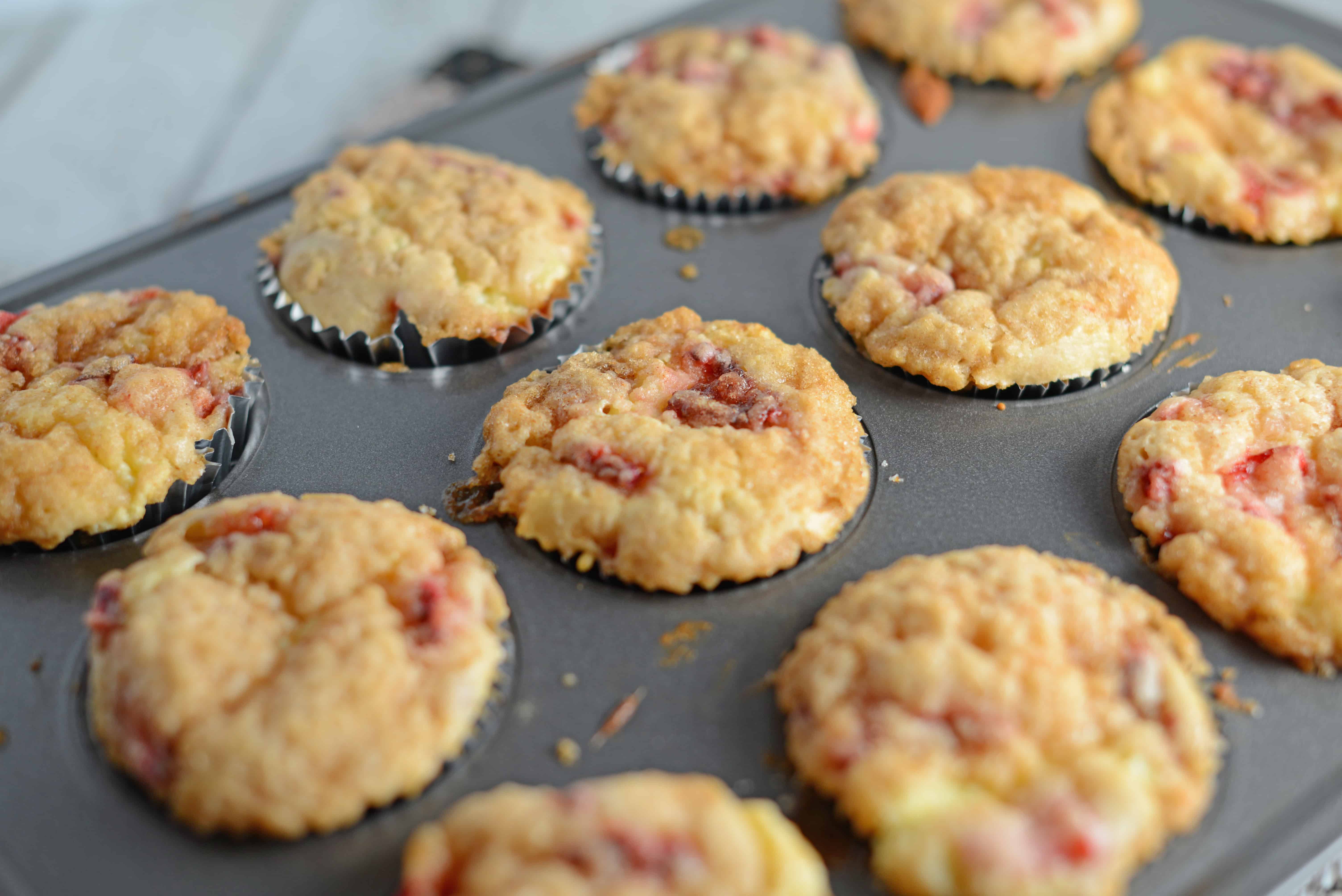 Strawberry Cream Cheese Muffins-- like eating strawberries 'n cream cupcakes for breakfast!! Super moist and creamy using fresh or frozen strawberries. www.savoryexperiments.com