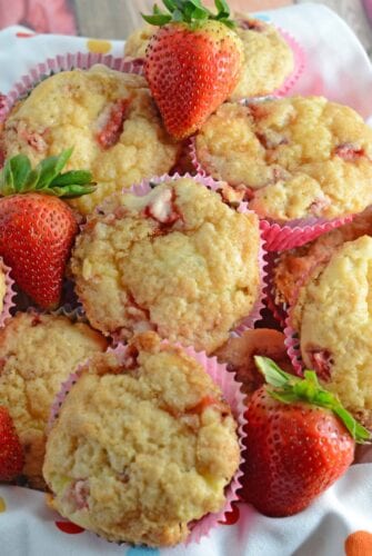 Strawberry Cream Cheese Muffins-- like eating strawberries 'n cream cupcakes for breakfast!! Strawberry shortcake, in a muffin, super moist and creamy using fresh or frozen strawberries. www.savoryexperiments.com