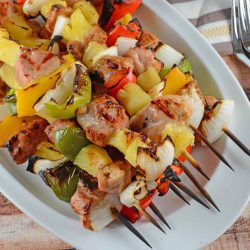 Teriyaki Pork Kabobs Recipe - Kabobs on the grill are a class summer meal. Marinated pork tenderloin paired with pineapple, bell pepper and sweet onion, makes this kabob recipe an quick dinner recipe. www.savoryexperiments.com