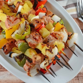 Teriyaki Pork Kabobs Recipe - Kabobs on the grill are a class summer meal. Marinated pork tenderloin paired with pineapple, bell pepper and sweet onion, makes this kabob recipe an quick dinner recipe. www.savoryexperiments.com