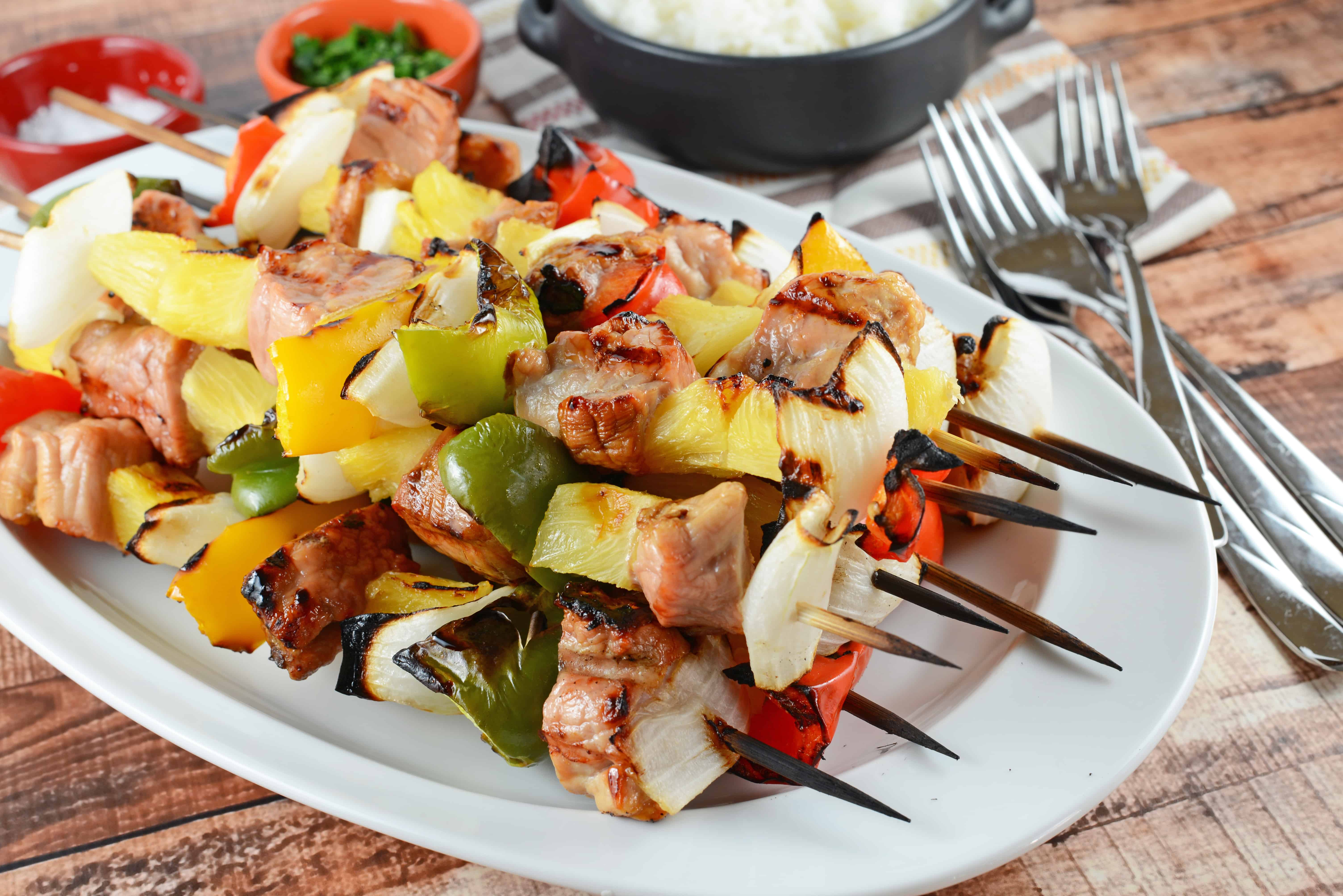 Teriyaki Pork Kabobs Recipe - Kabobs on the grill are a class summer meal. Marinated pork tenderloin paired with pineapple, bell pepper and sweet onion, makes this kabob recipe an quick dinner recipe. www.savoryexperiments.com