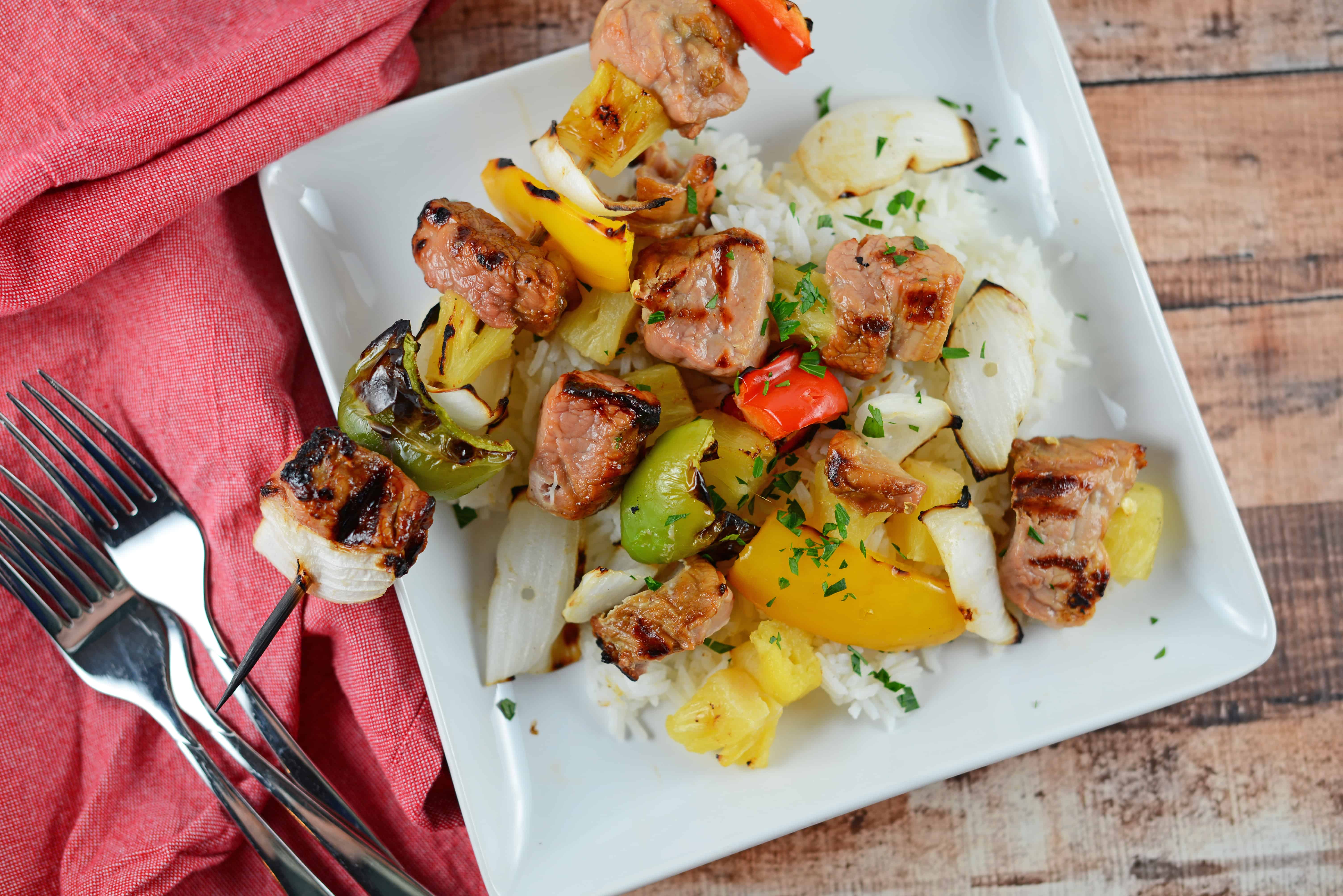 Teriyaki Pork Kabobs Recipe - Kabobs on the grill are a class summer meal. Marinated pork tenderloin paired with pineapple, bell pepper and sweet onion, makes this kabob recipe an quick dinner recipe. www.savoryexperiments.com