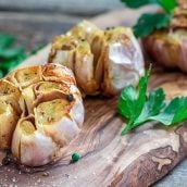 roast garlic on a wood board