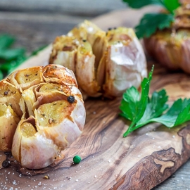 roast garlic on a wood board