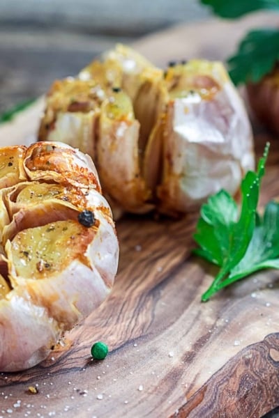 roast garlic on a wood board