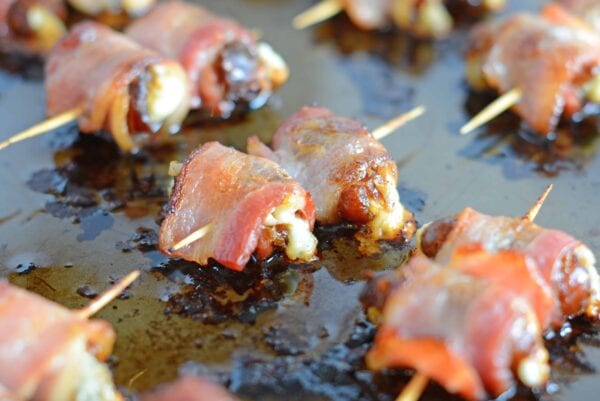 bacon-wrapped-dates-1 Bacon Wrapped Dates are an easy, 4 ingredient appetizer or snack perfect for watching the big game in your pajamas or a fancy cocktail party.