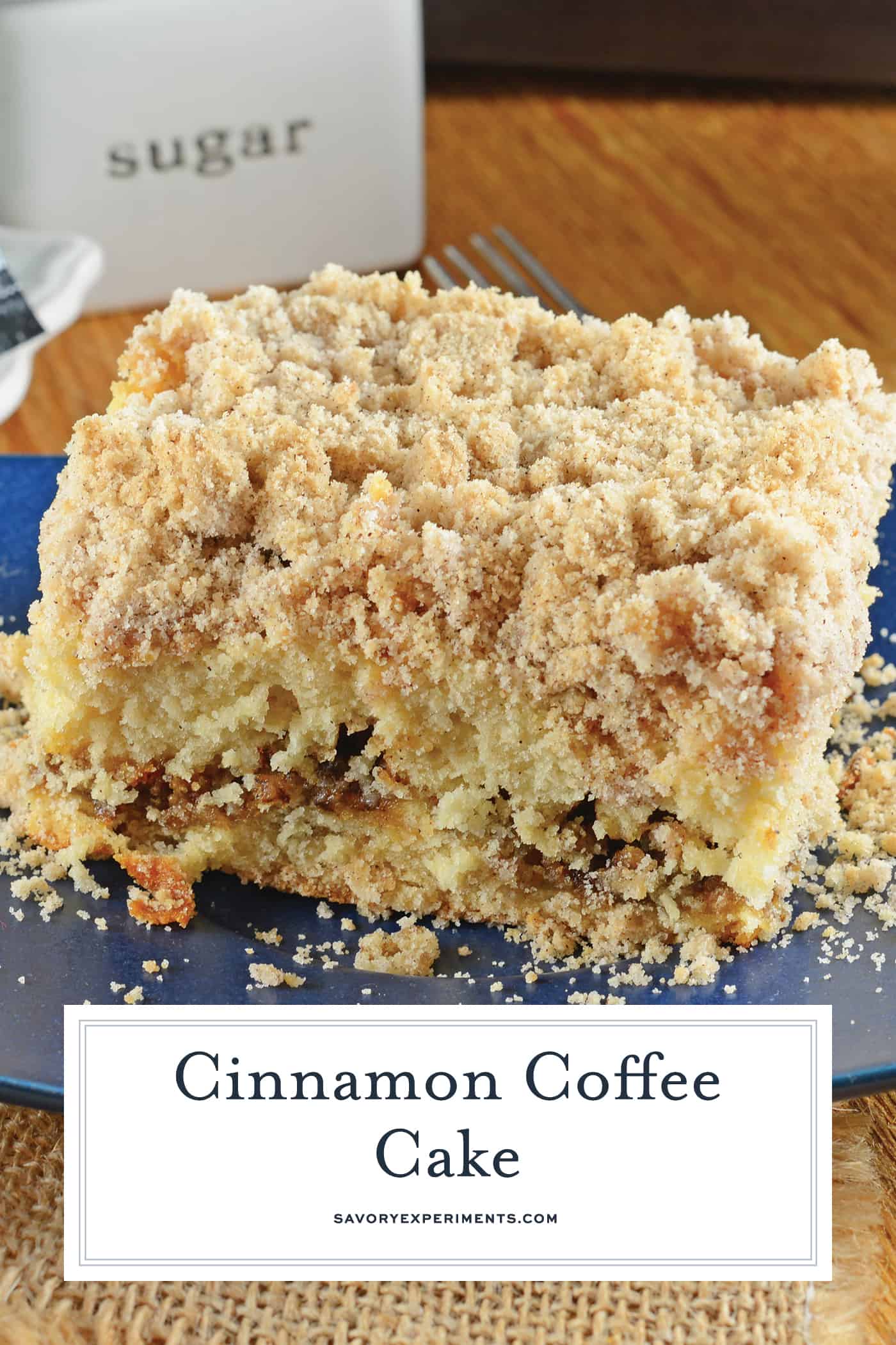 angled shot of slice of cinnamon coffee cake on plate with text overlay