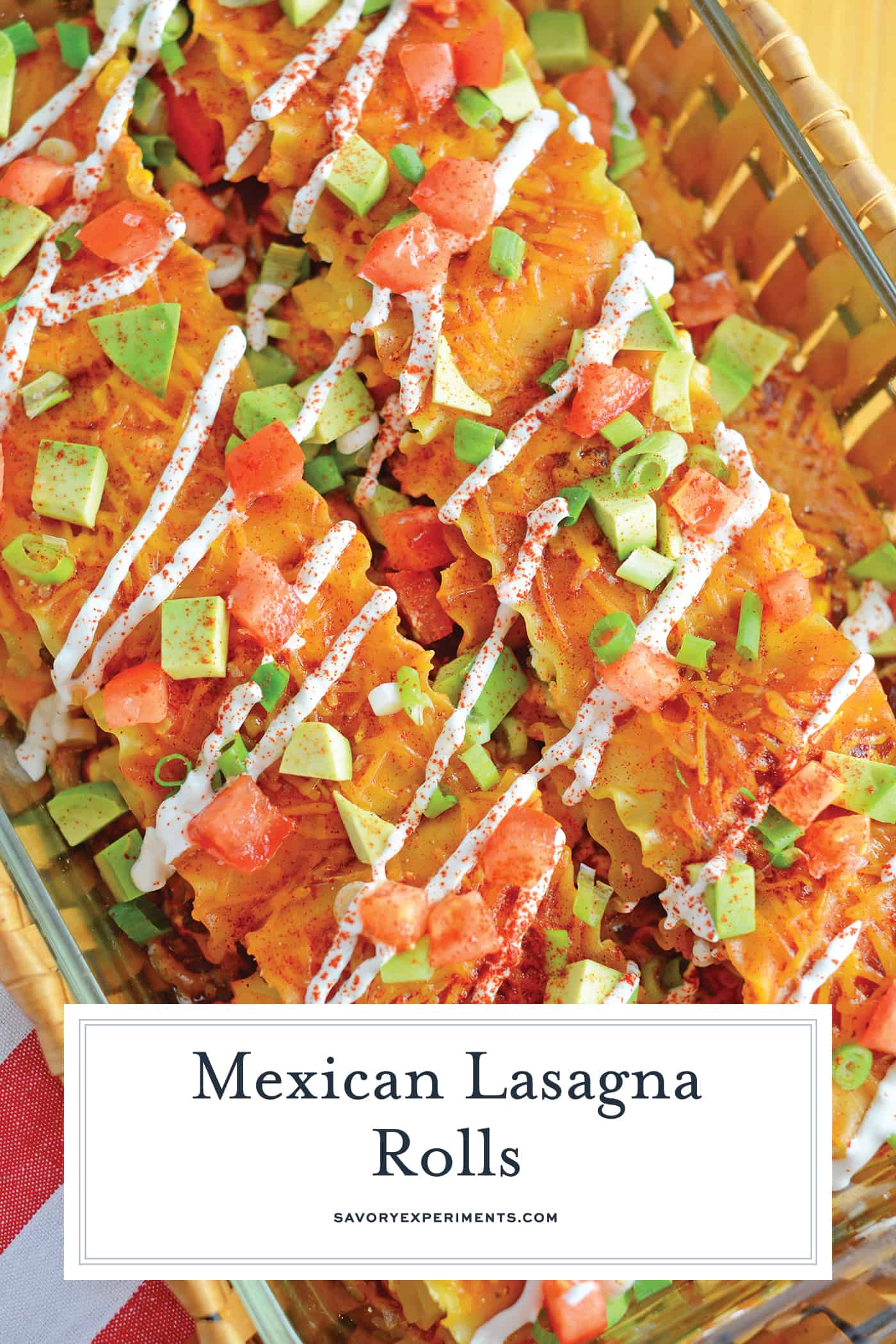 Mexican Lasagna Rolls are the best marriage of taco lasagna and traditional lasagna! They're so easy to put together, even the kids can help make them! #lasagnarollsrecipe #lasagnarollups #mexicanlasagnarecipes www.savoryexperiments.com