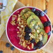 overhead of a pink smoothie bowl in white bowl