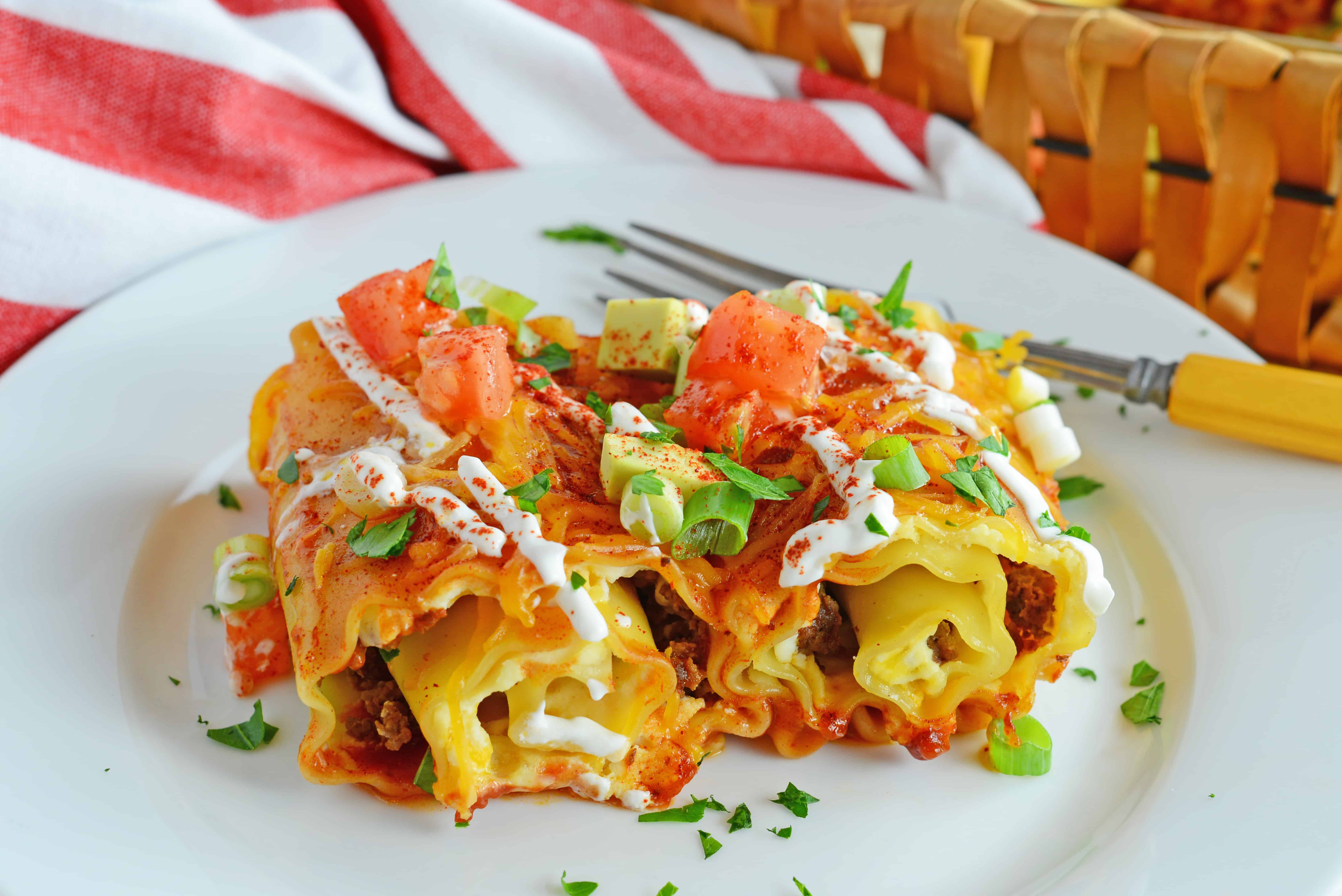 Mexican Lasagna Rolls are the best marriage of taco lasagna and traditional lasagna. So easy the kids can help make them! 