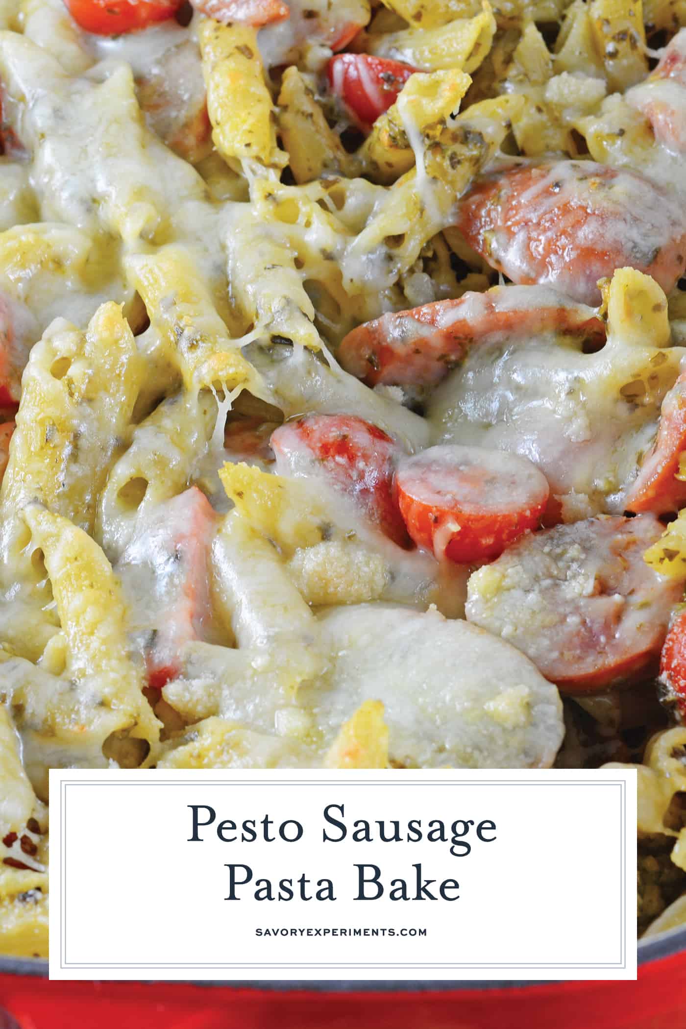 Pesto Sausage Pasta Bake is the perfect easy pasta dish! Creamy pesto sauce, pasta, smoked sausage and Italian cheese make this the ideal meal! #pastabake #bakedpastadishes #sausagepastabake www.savoryexperiments.com