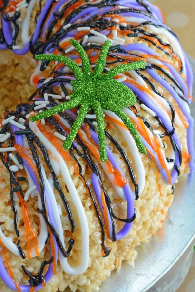 Halloween Rice Krispie Cake is stuffed with fluff! What better way to celebrate the holiday than with a giant homemade rice krispies treat?