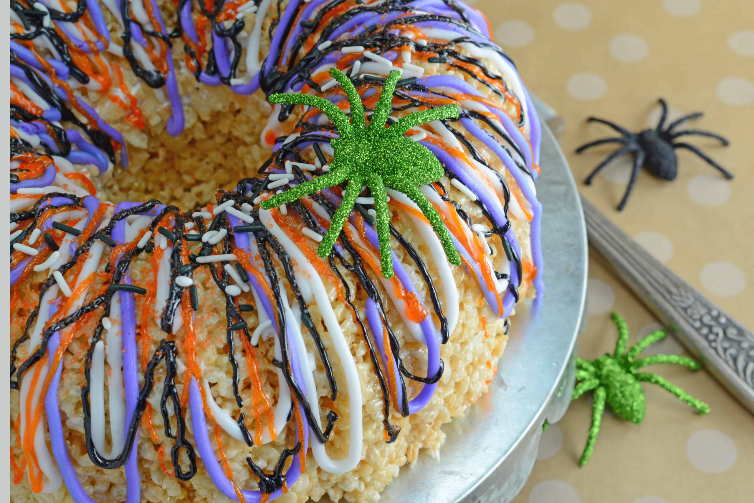 Halloween Rice Krispie Cake is stuffed with fluff! What better way to celebrate the holiday than with a giant homemade rice krispies treat?