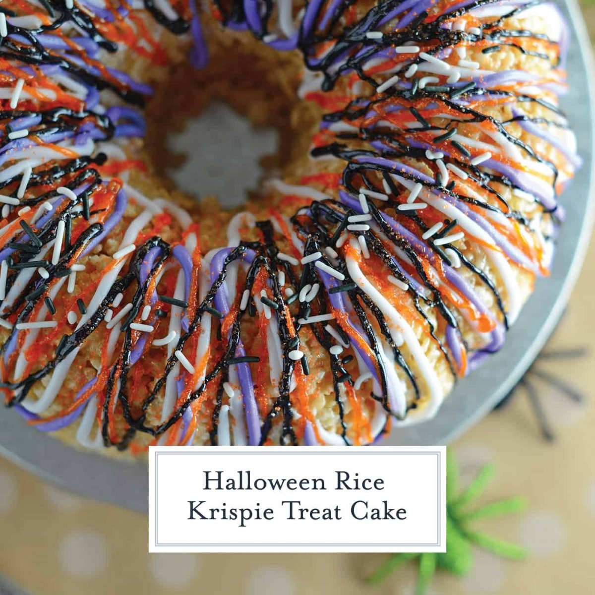 Halloween Rice Krispie Treat Cake is stuffed with fluff! What better way to celebrate the holiday than with a giant homemade rice krispies treat? #halloweenricekrispietreats #ricekrispietreatcake #halloweensnacks www.savoryexperiments.com