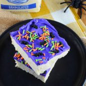 Halloween Sugar Cookie Bars are thick and chewy, frosted with a classic buttercream and topped with festive sprinkles.