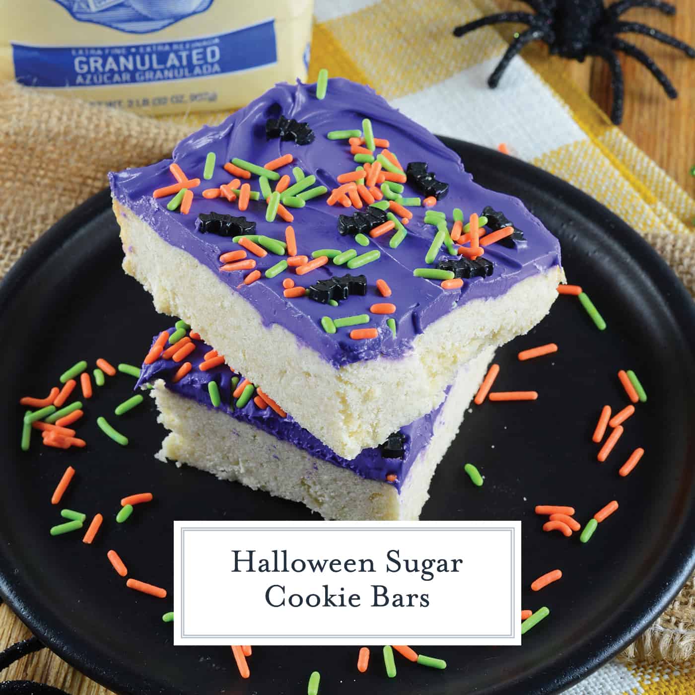 Halloween Sugar Cookie Bars are thick and chewy, frosted with a classic buttercream and topped with festive sprinkles. Perfect for the whole family! #sugarcookiebars #halloweendesserts #halloweensnacks www.savoryexperiments.com