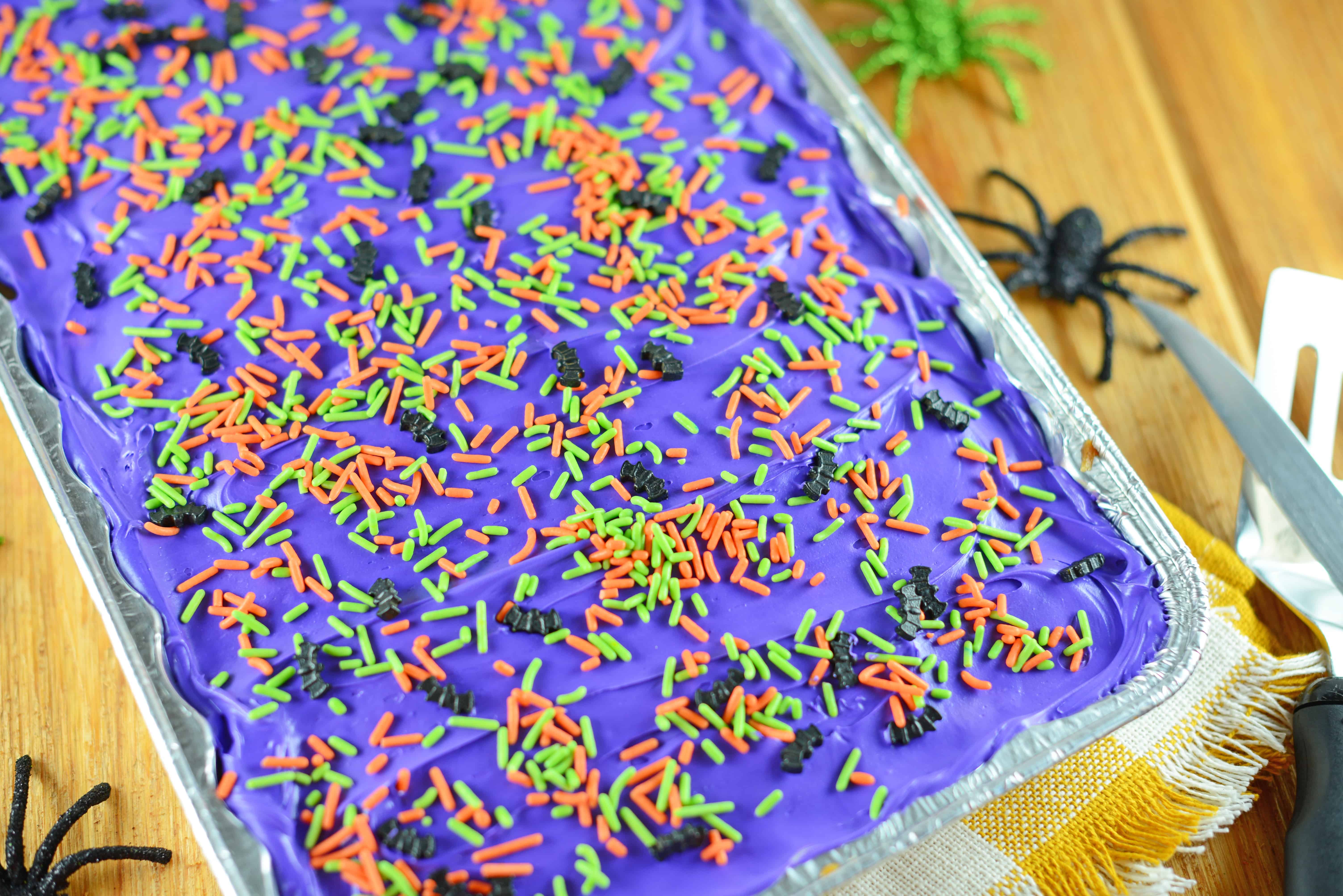 Halloween Sugar Cookie Bars are thick and chewy, frosted with a classic buttercream and topped with festive sprinkles.
