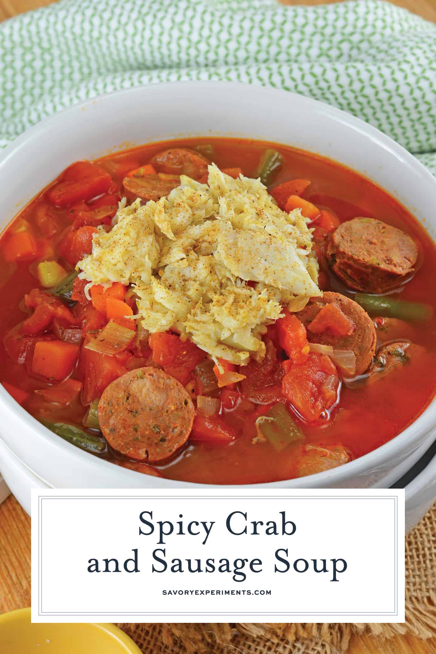 Spicy Crab and Sausage Soup is a quick, easy and flavorful appetizer or dinner recipe! Packed full of vegetables, sausage and crab, you can't go wrong! #crabsoup #sausagesoup #spicysouprecipes www.savoryexperiments.com