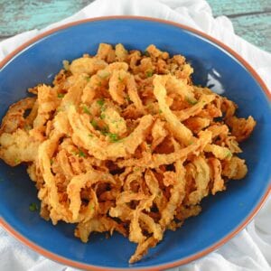 Onion Strings are buttermilk soaked and lightly seasoned fried onions. Perfect for topping burgers, a snack or green bean casserole.