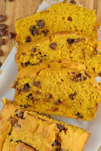 Chocolate Chip Pumpkin Bread is easy to make, soft and flavorful. A perfect loaf for breakfast or dessert on a holiday or any other day! #pumpkinchocolatechipbread #pumpkinbreadwithchocolatechips www.savoryexperiments.com