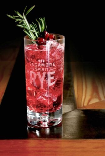 Holiday Whiskey Fizz is a bubbly holiday cocktail featuring Sagamore Spirits rye whiskey, club soda, cranberry syrup and lime juice.