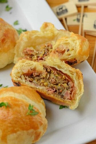 Mini Beef Wellington is one of the best party appetizers out there! Mini pieces of beef tenderloin seasoned with mushrooms, thyme, Dijon and prosciutto, all tucked into puff pastry.