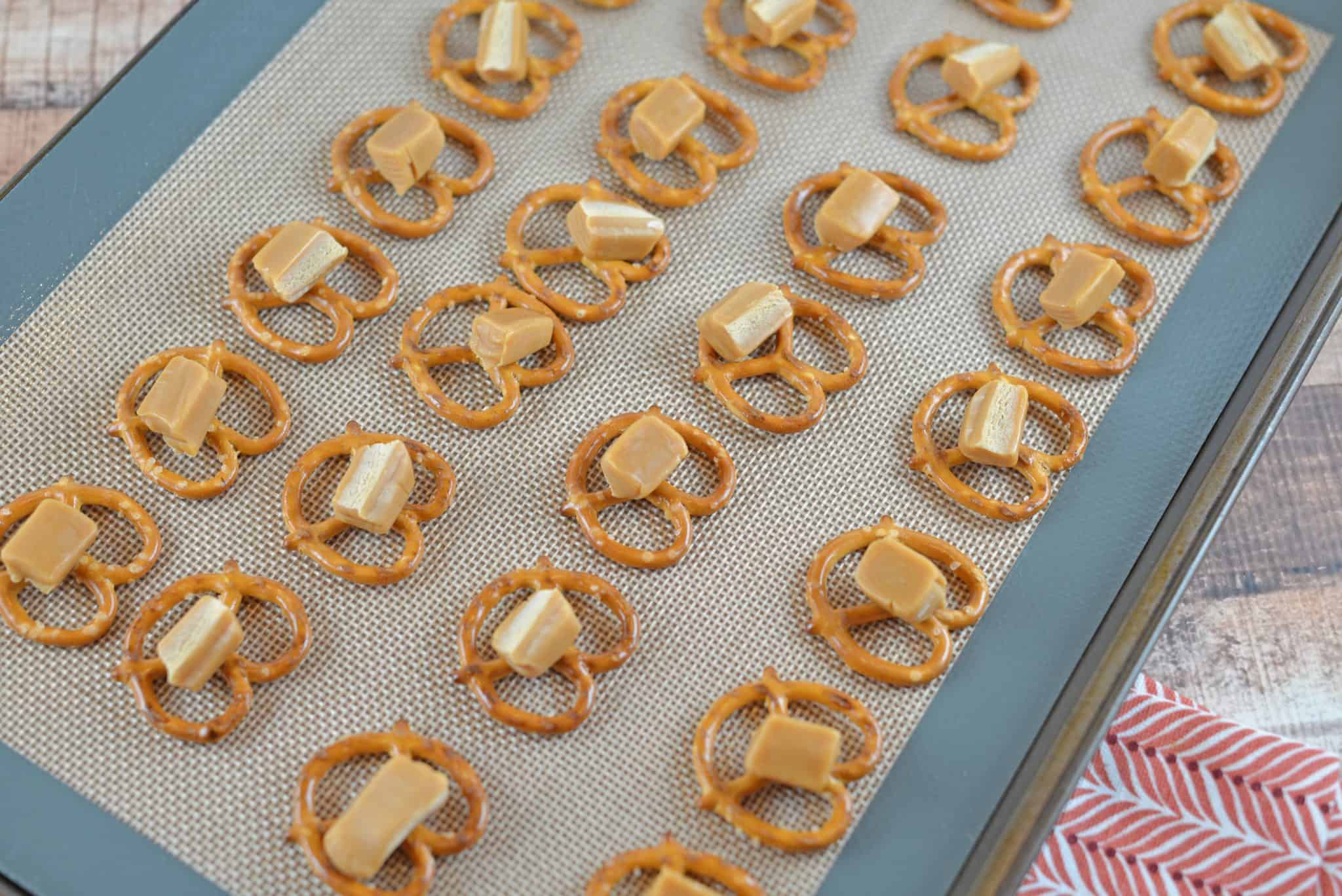 A close up of pretzels with caramel pieces