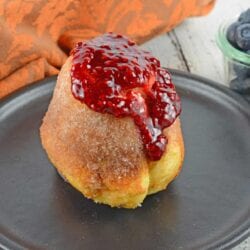 Cinnamon Sugar Popovers are easier to make then you think! A crispy outside and chewy inside coated with cinnamon and sugar, then drizzled in a fresh raspberry sauce.