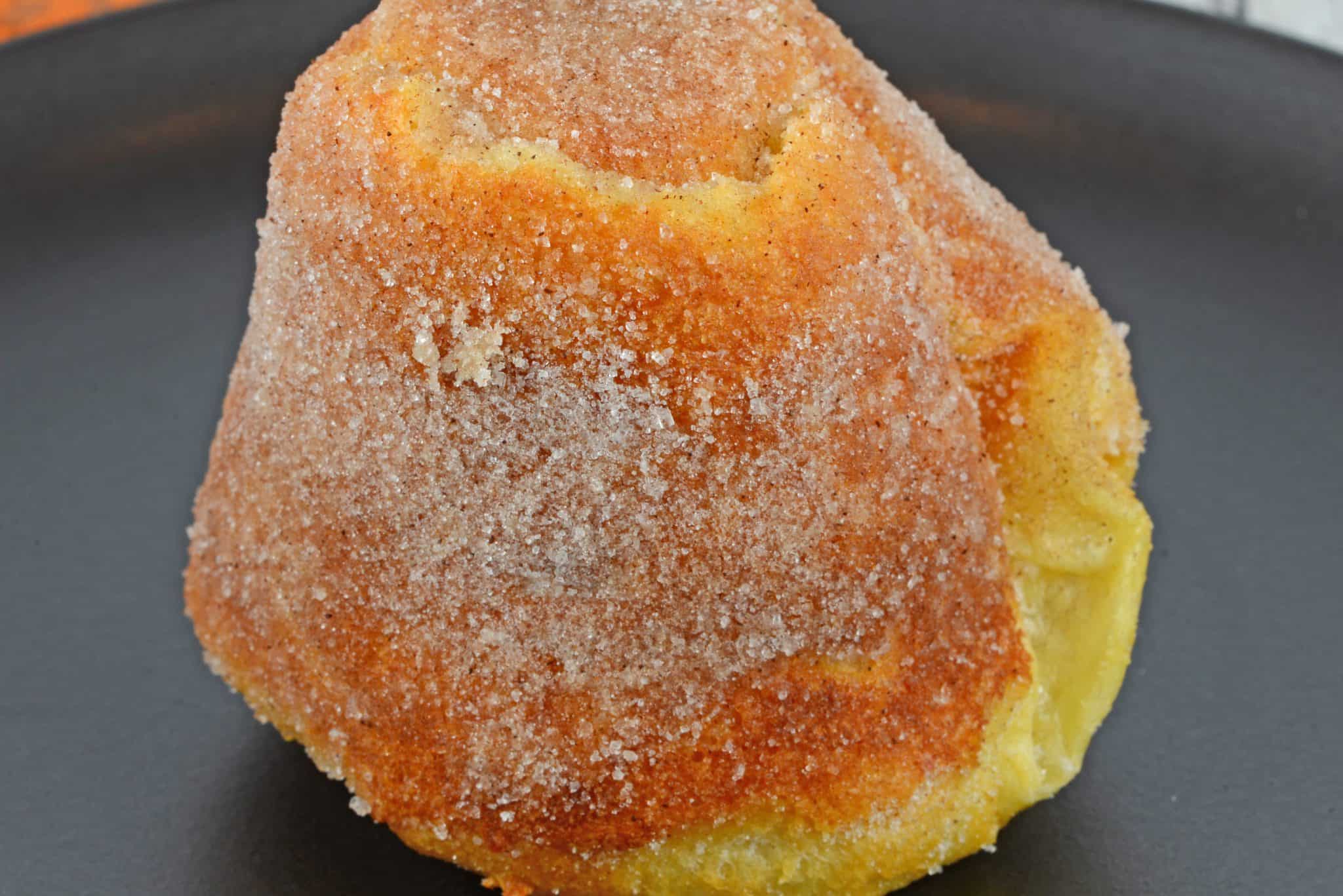 Cinnamon Sugar Popovers are easier to make then you think! A crispy outside and chewy inside coated with cinnamon and sugar, then drizzled in a fresh raspberry sauce. 