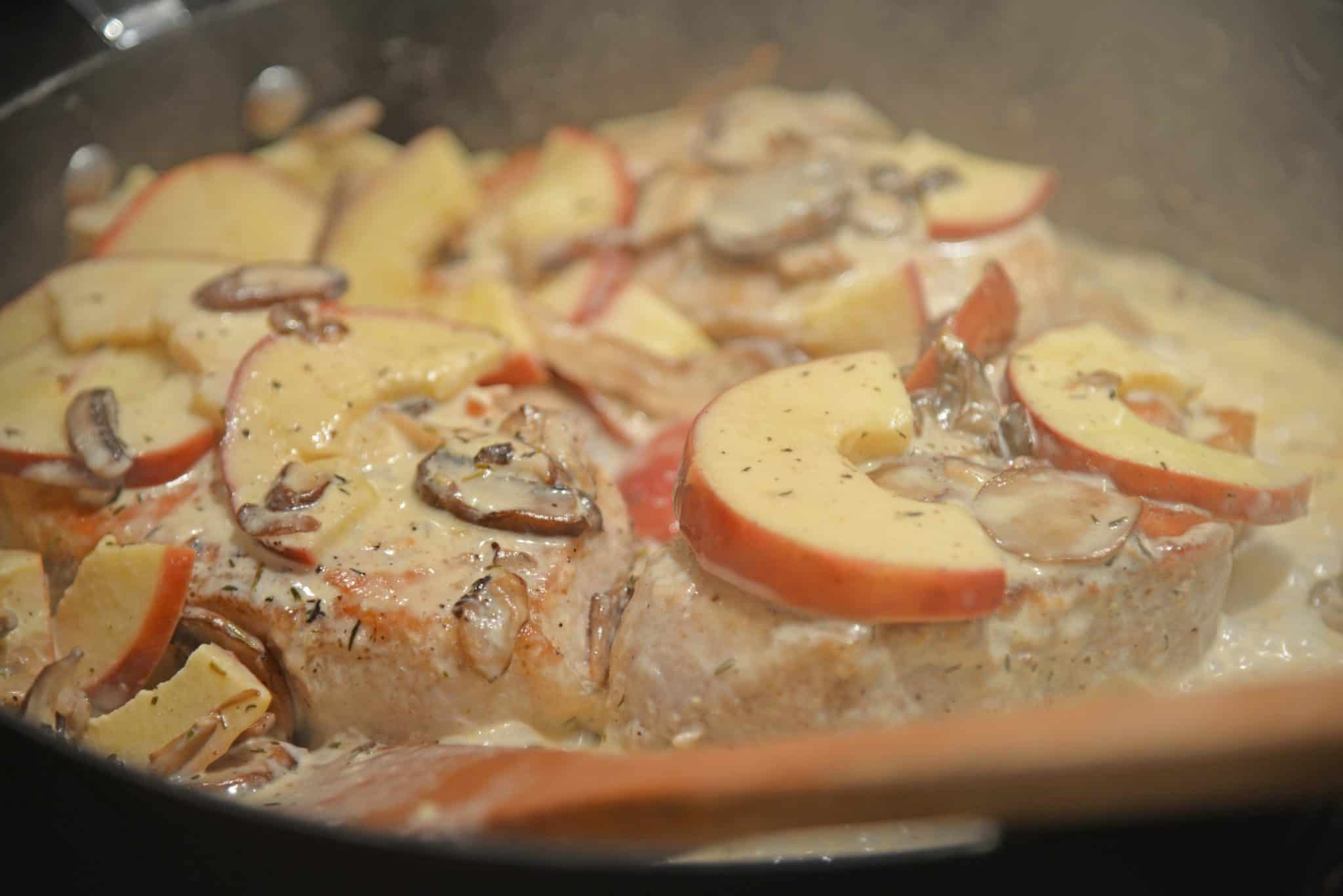 Creamy Apple Pork Chops are a wholesome meal your whole family will enjoy. Mushrooms, apples, juicy pork chops in a savory cream sauce all ready in just 15 minutes. Serve with rice, couscous or noodles. #easyporkchoprecipe www.saovryexperiments.com 