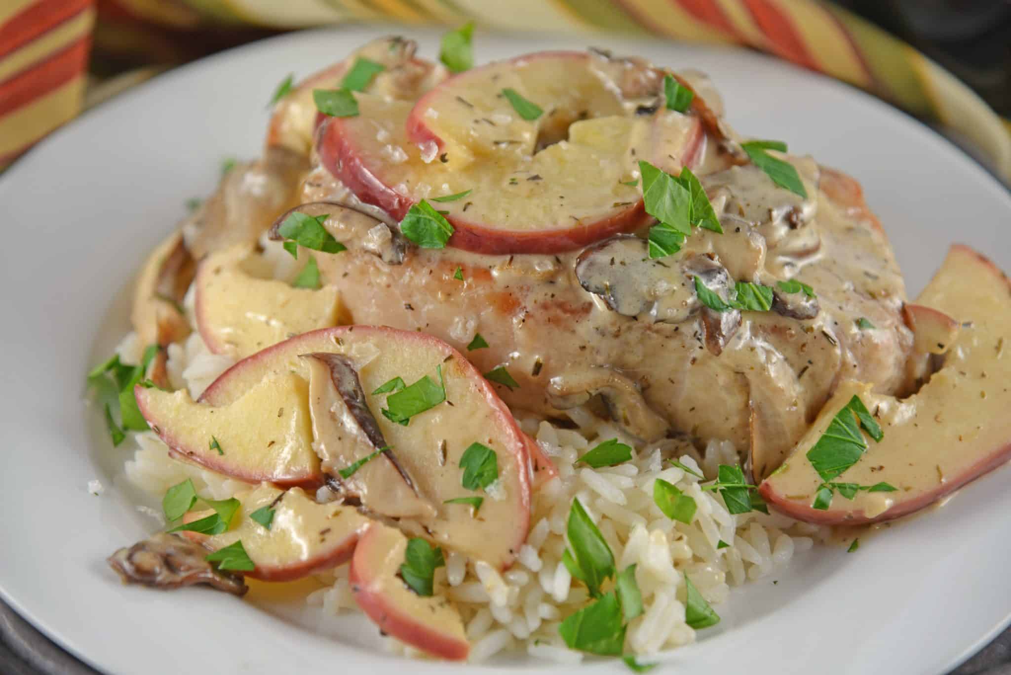 Creamy Apple Pork Chops are a wholesome meal your whole family will enjoy. Mushrooms, apples, juicy pork chops in a savory cream sauce all ready in just 15 minutes. Serve with rice, couscous or noodles. #easyporkchoprecipe www.saovryexperiments.com 