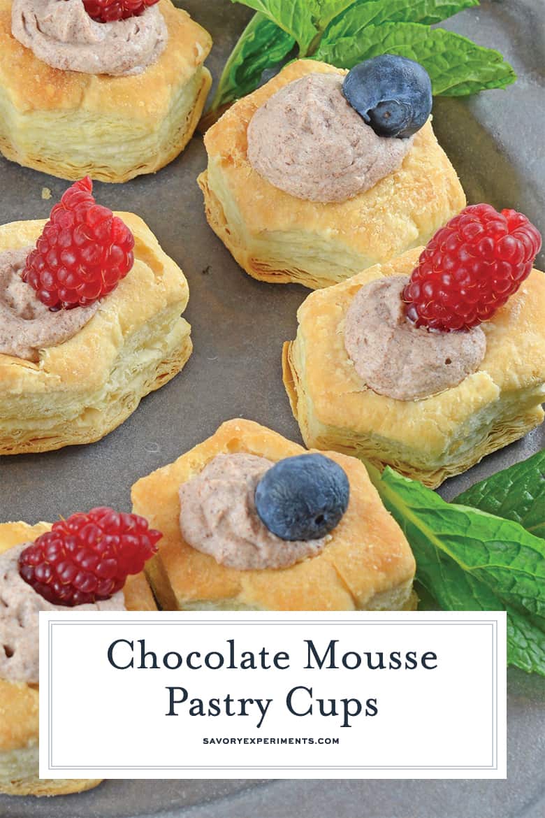 Close up of chocolate mousse pastry cups with fresh fruit 