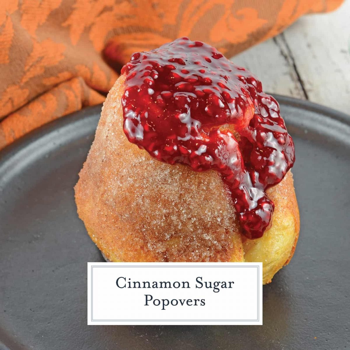 Cinnamon Sugar Popovers are easier to make than you think! A crispy outside and chewy inside coated with cinnamon and sugar, then drizzled in a fresh raspberry sauce. Perfect for a decadent breakfast or dessert. #popovers #howtomakepopovers www.savoryexperiments.com