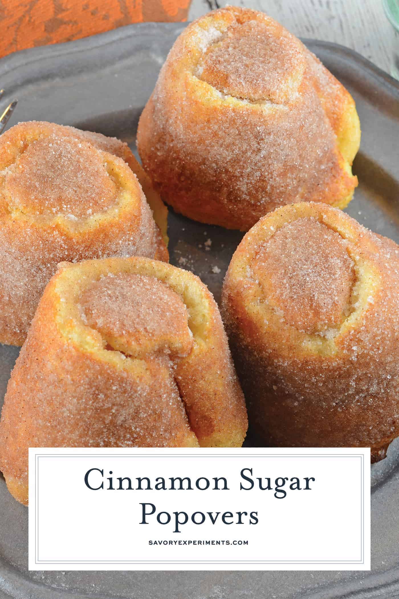 Cinnamon Sugar Popovers are easier to make than you think! A crispy outside and chewy inside coated with cinnamon and sugar, then drizzled in a fresh raspberry sauce. Perfect for a decadent breakfast or dessert. #popovers #howtomakepopovers www.savoryexperiments.com