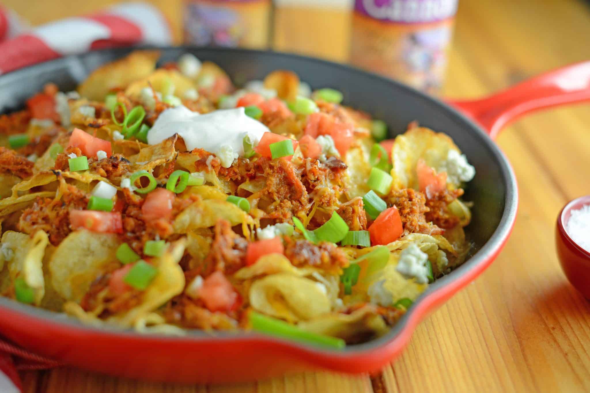 Pulled Pork Potato Chip Nachos are an easy appetizer or meal that your whole family will love made with kettle cooked potato chips and zesty pulled pork! 