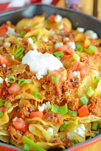 Pulled Pork Potato Chip Nachos are an easy appetizer or meal that your whole family will love made with kettle cooked potato chips and zesty pulled pork!