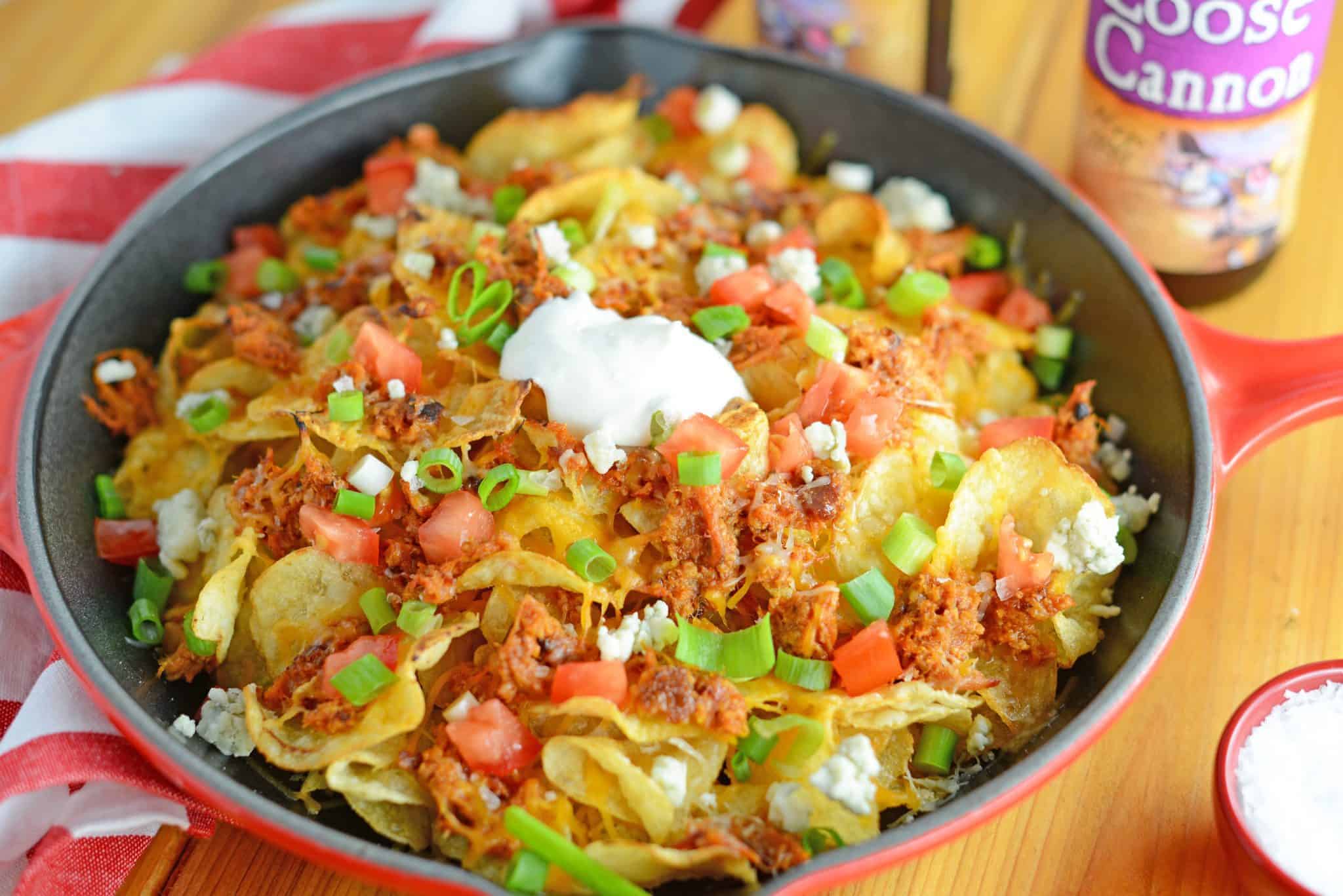 Pulled Pork Potato Chip Nachos are an easy appetizer or meal that your whole family will love made with kettle cooked potato chips and zesty pulled pork!