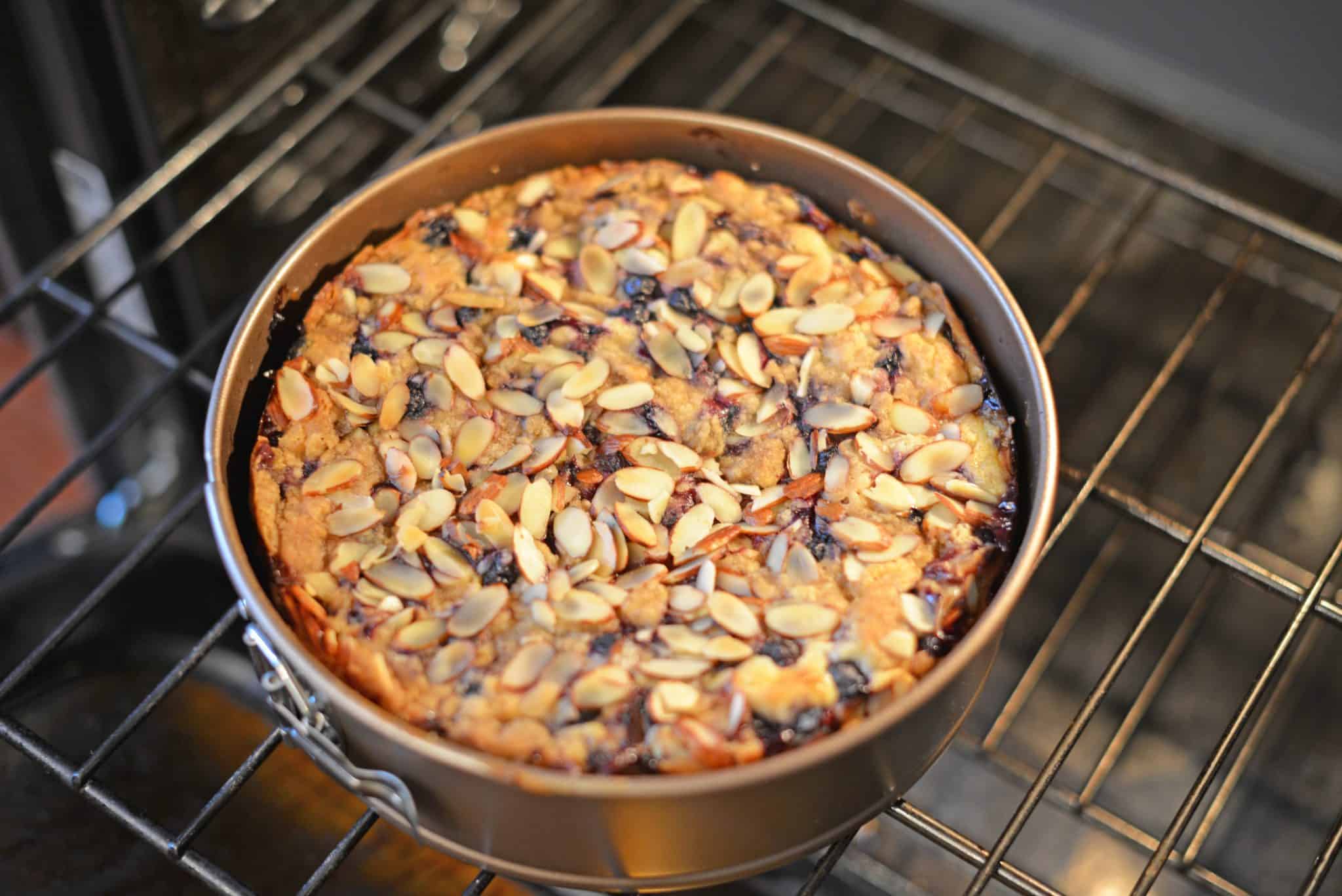 Blueberry Cream Cheese Coffee Cake is an easy coffee cake recipe with three layers of tender cake, silky cream cheese and almond streusel topping.