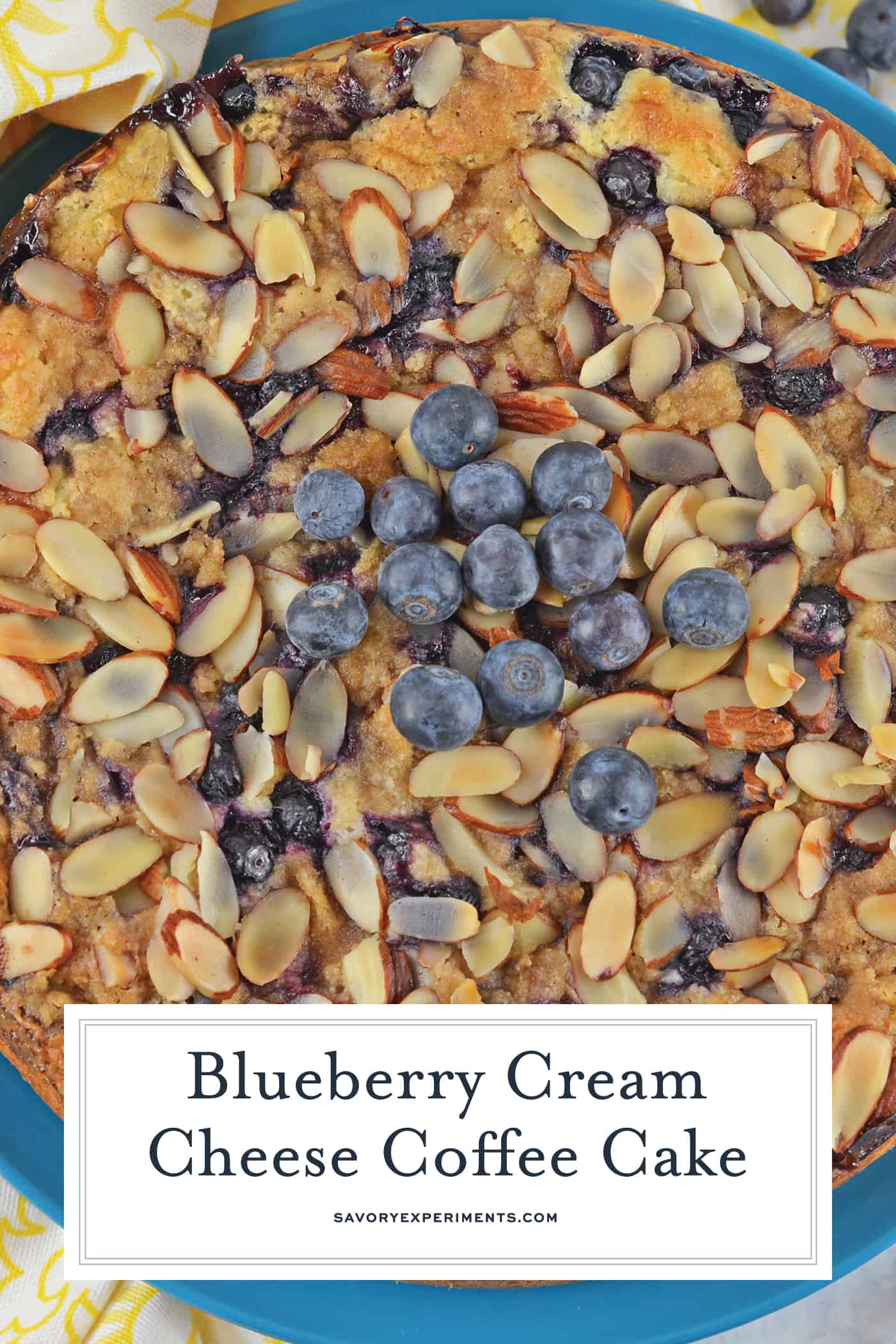 Blueberry Cream Cheese Coffee Cake is an easy coffee cake recipe with three layers of tender cake, silky cream cheese and almond streusel topping. #creamcheesecoffeecake #coffeecakerecipe #creamcheesecoffeecake www.savoryexperiments.com
