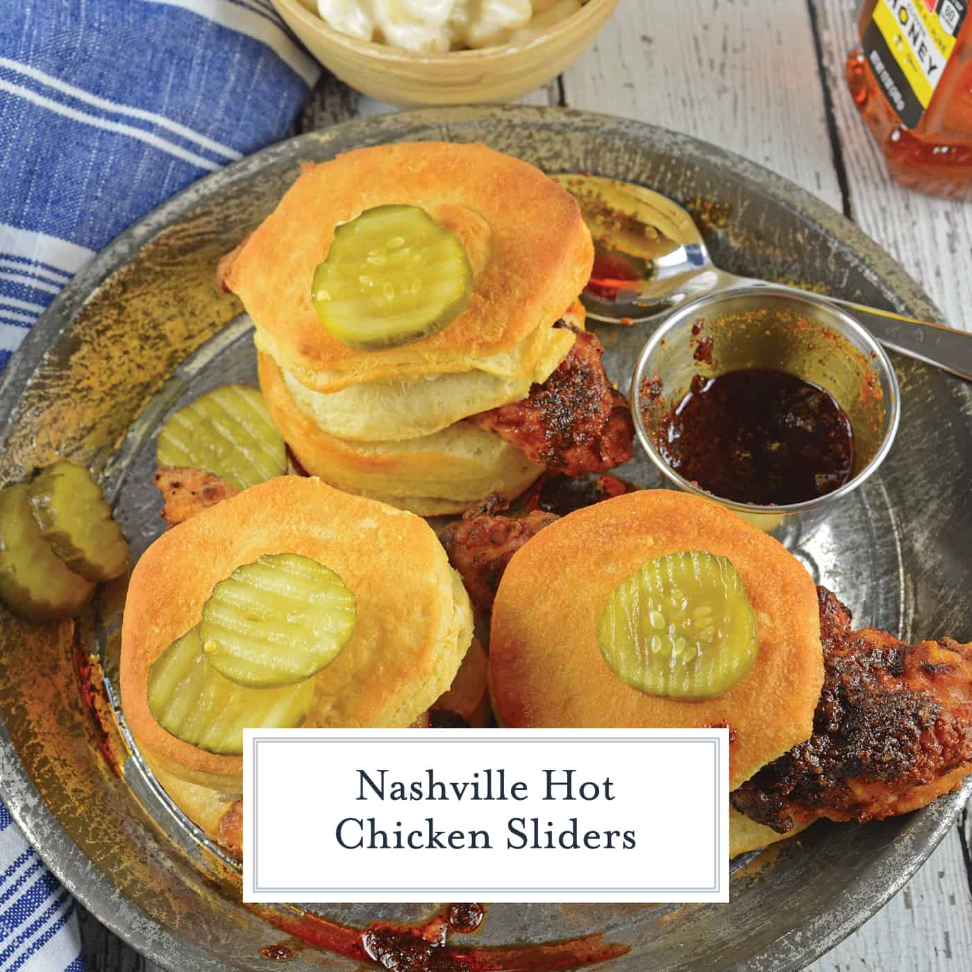Nashville Hot Chicken Sliders are perfect as a dinner or appetizer. Crispy fried chicken dredged in spicy sauce served on buttermilk biscuits with honey habanero pickles. #nashvillehotchicken #sliderrecipes www.savoryexperiments.com