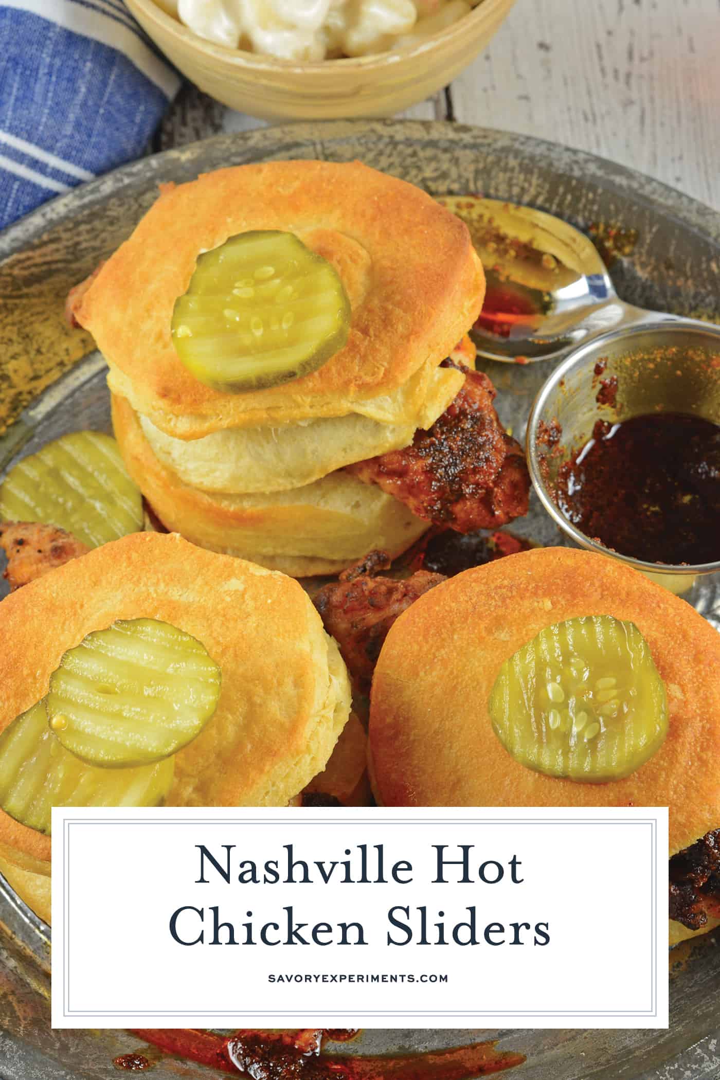 Nashville Hot Chicken Sliders are perfect as a dinner or appetizer. Crispy fried chicken dredged in spicy sauce served on buttermilk biscuits with honey habanero pickles. #nashvillehotchicken #sliderrecipes www.savoryexperiments.com