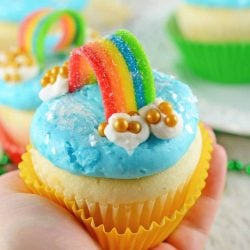 Rainbow Cupcakes are super easy and cute. The perfect cupcake for St. Patrick's Day, children's birthday parties or any random day of the week! #rainbowcupcakes #stapatricksdaydesserts www.savoryexperiments.com