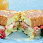 Strawberry Stuffed French Toast is made with mascarpone, Dutch honey syrup, fresh strawberries, and buttery brioche, pound cake, or angel food, for a perfectly delicious dish to enjoy for breakfast! #stuffedfrenchtoast #creamcheesestuffedfrenchtoast www.savoryexperiments.com